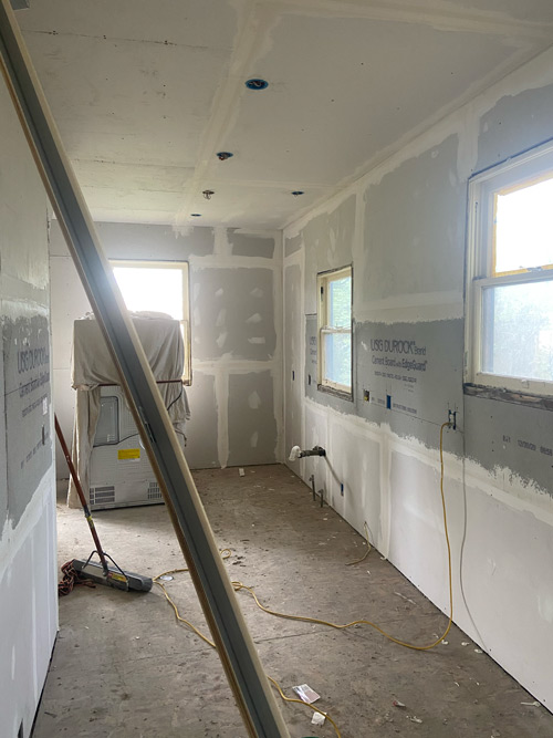 Picture of drywall, hardie board and mud and tape.