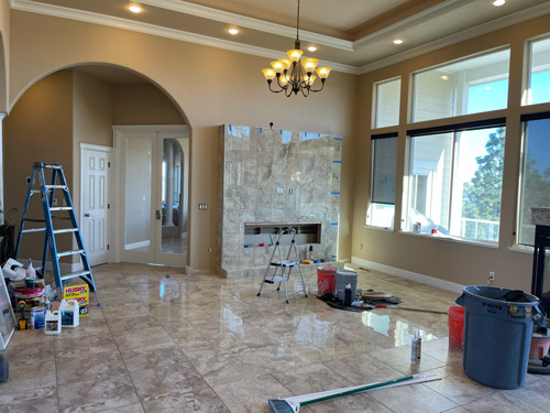 Picture of tile and grout floor and fireplace.