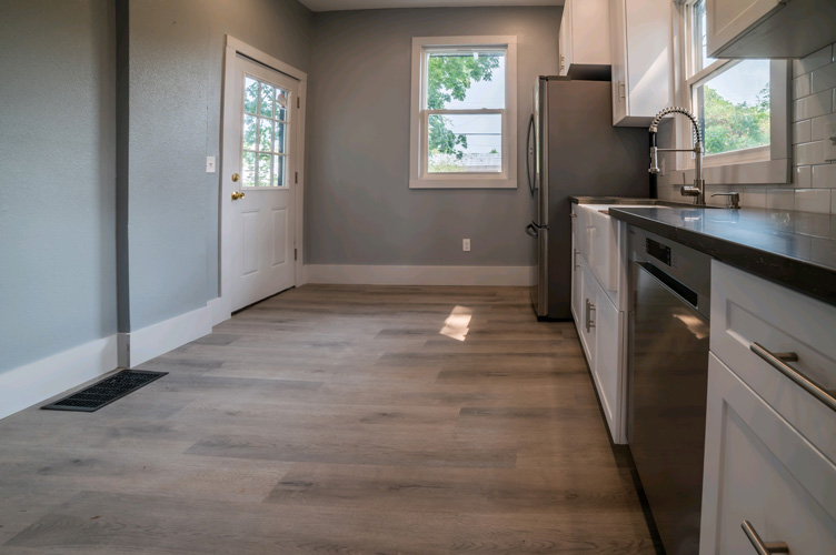 A picture of new flooring in a kitchen.