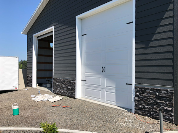 Otis Orchards HOA pole barn with rock to match house.