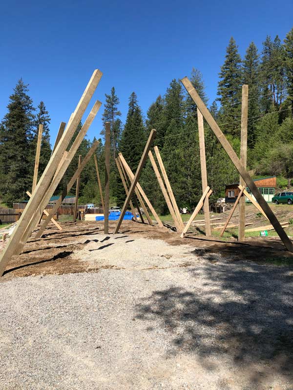 Newman Lake pole barn starting to set post.