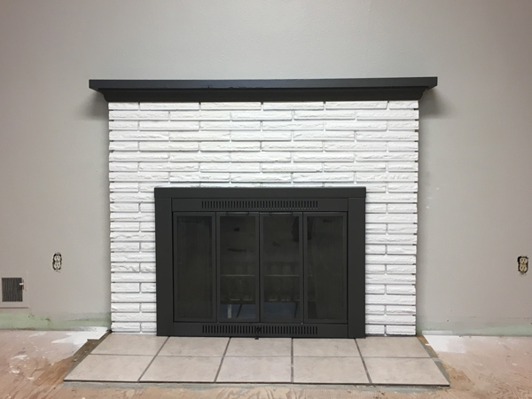 Finished painting brick fireplace Spokane Valley.